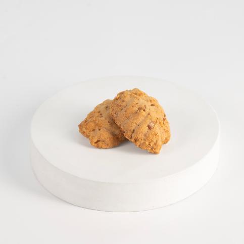 Two cookies on a white plate with a white background Kahk - Tseppas